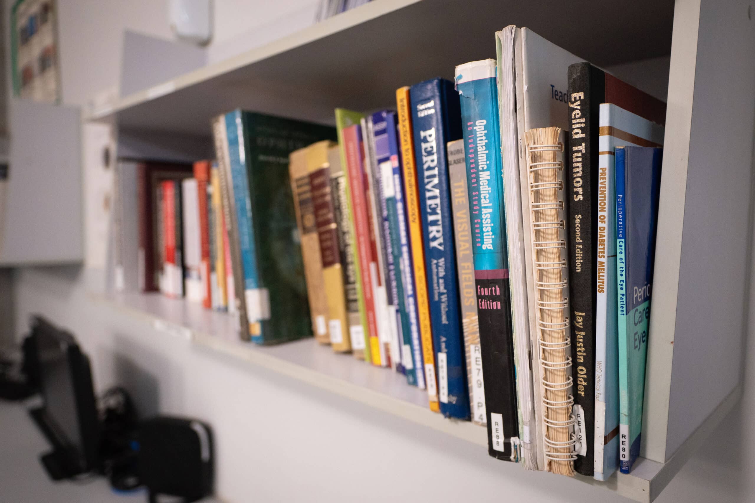 A bookshelf with medical books