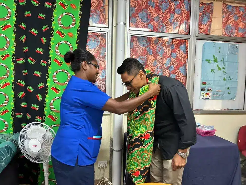 Dr Andronico Ly receives a traditional welcome