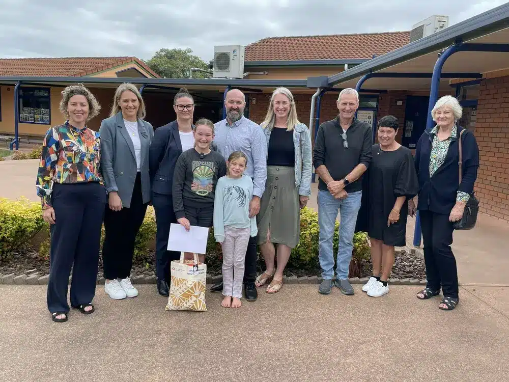 Isabelle with her family and teachers