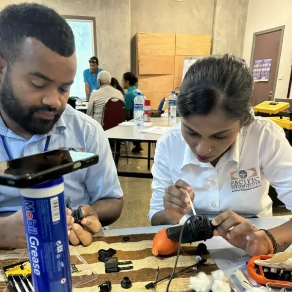 Fijian Technicians Naibuka Vunisa (left) and Bhavishna Ben