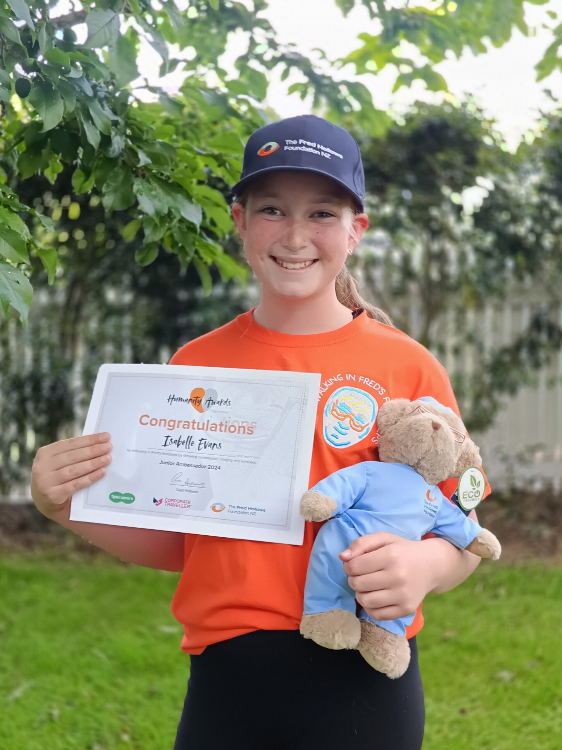Isabelle Evans holding her Humanity Awards certificate