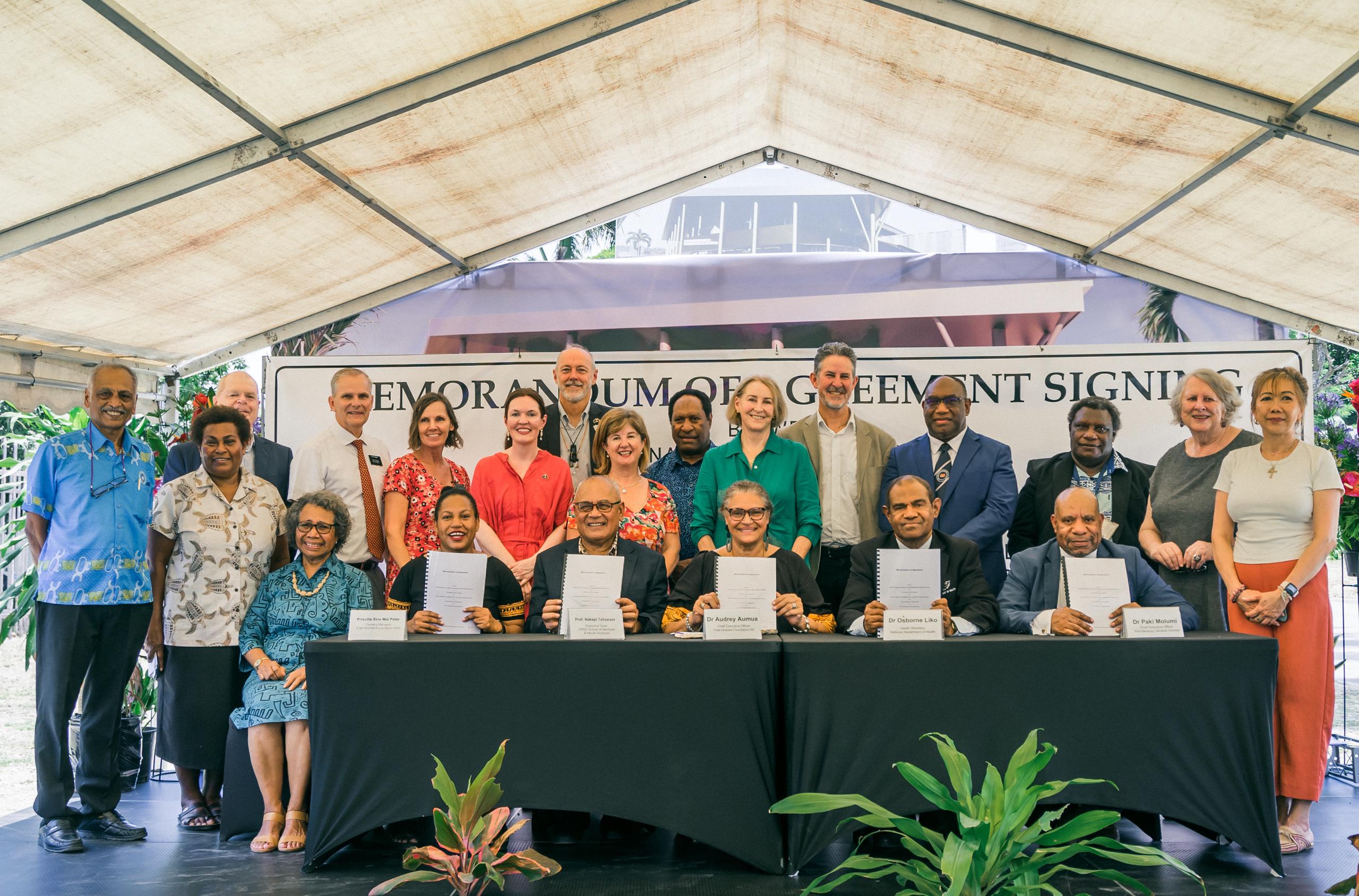 Key partners signing a memorandum of agreement in Papua New Guinea