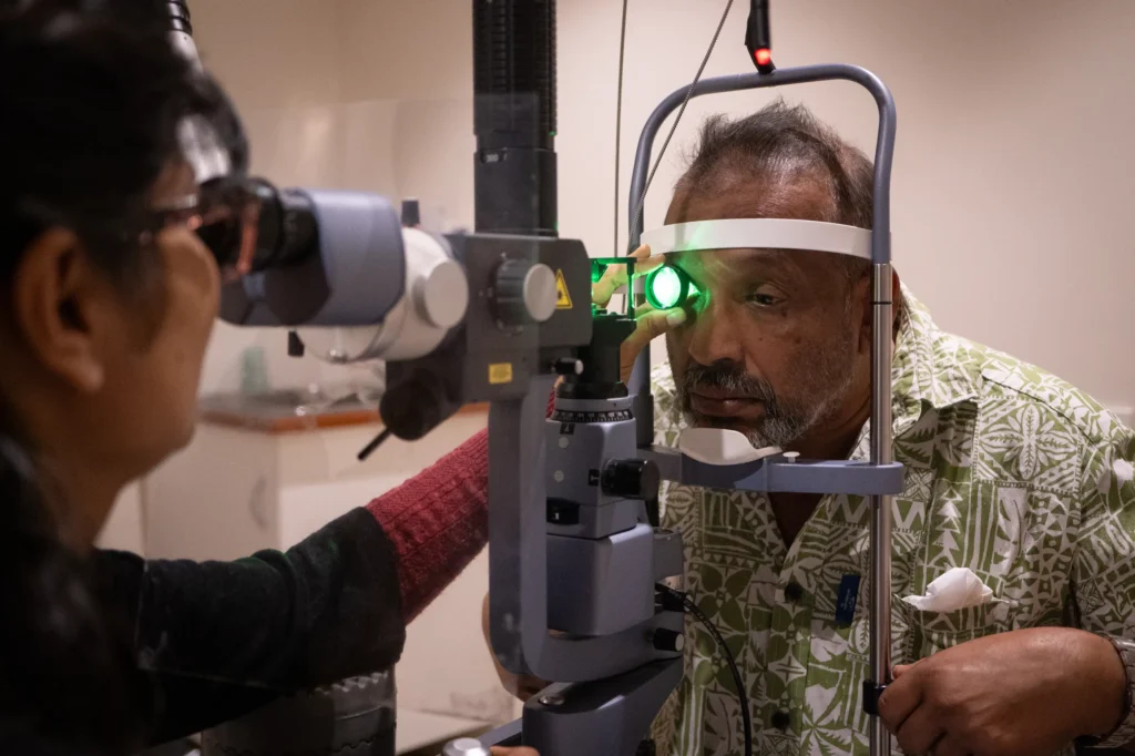 Mohammed having his eyes tested