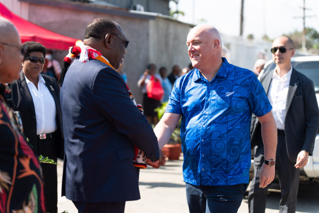 Prime Minister Christopher Luxon shaking hands with PNG Health Minister Elias Kapavore