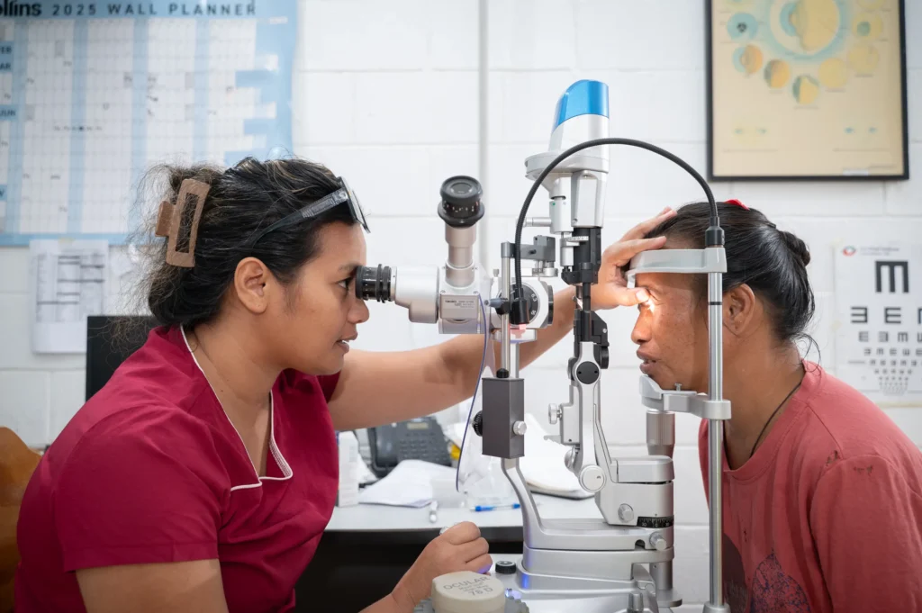 Dr Erena testing a patient's eyes