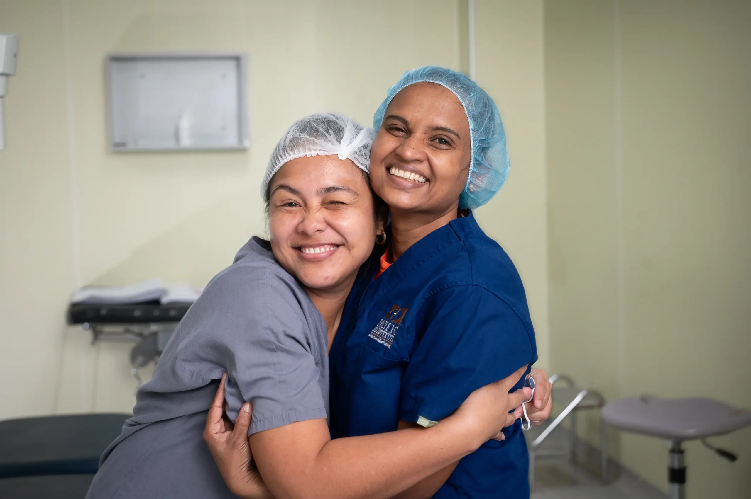 Two nurses hugging
