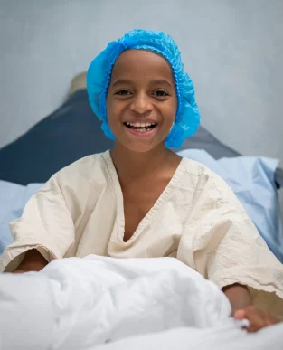 Meli in his hospital gown ready for surgery